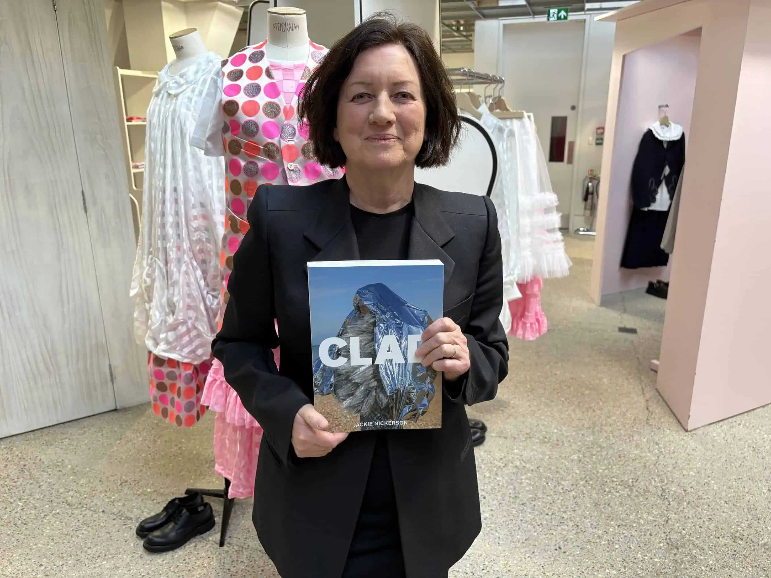 Jackie Nicholson with her first book, Clad